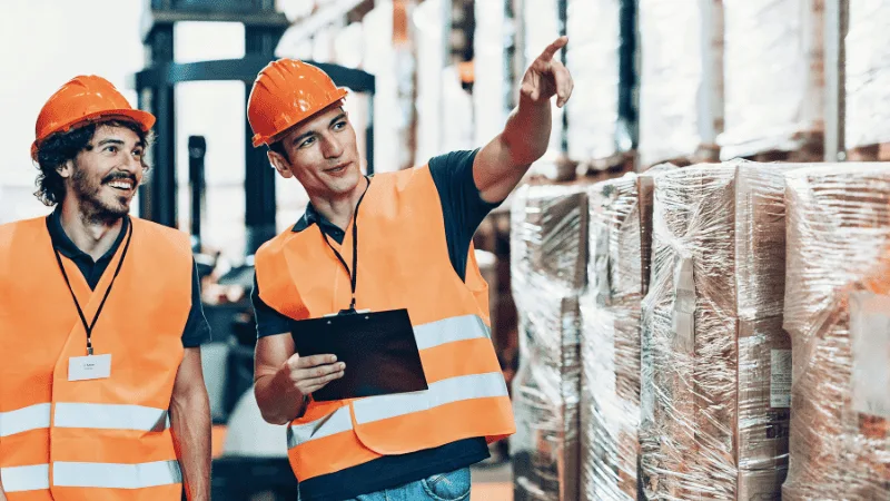 The supplier shows the customer around the warehouse